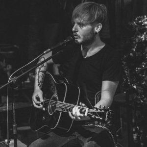 Clive Pendock, musician, playing live on stage in 2016.